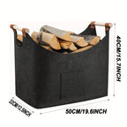 Black felt firewood basket with wooden handles and front pocket