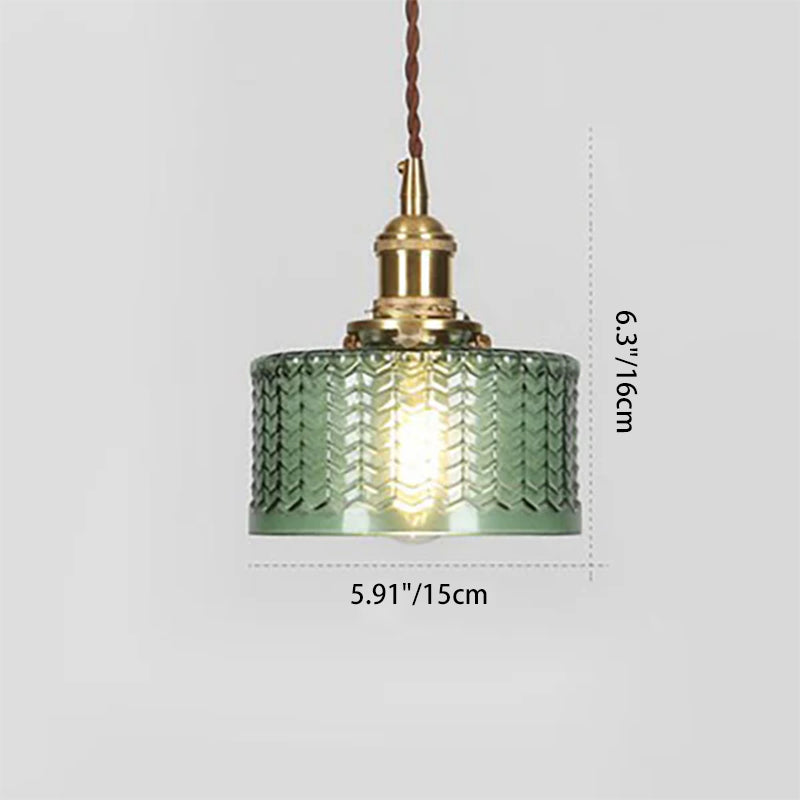 Round glass pendant light with textured shade and brass fitting