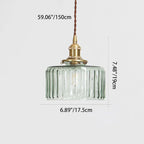 Round glass pendant light with textured shade and brass fitting