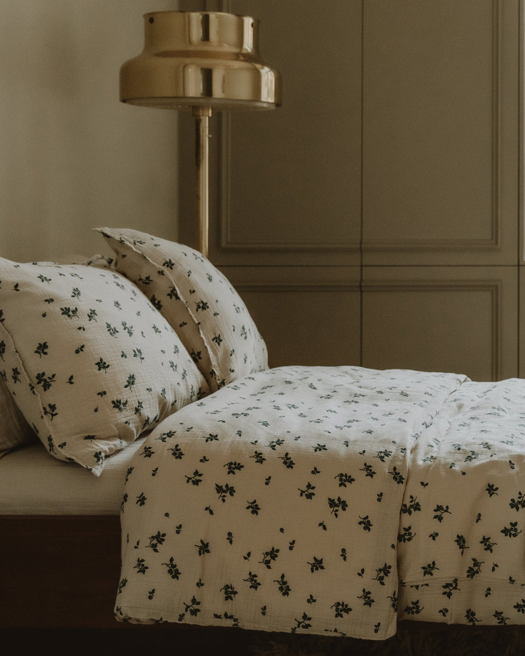 Blueberry muslin pillowcase with scattered blue floral pattern