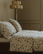 Blueberry muslin pillowcase with scattered blue floral pattern