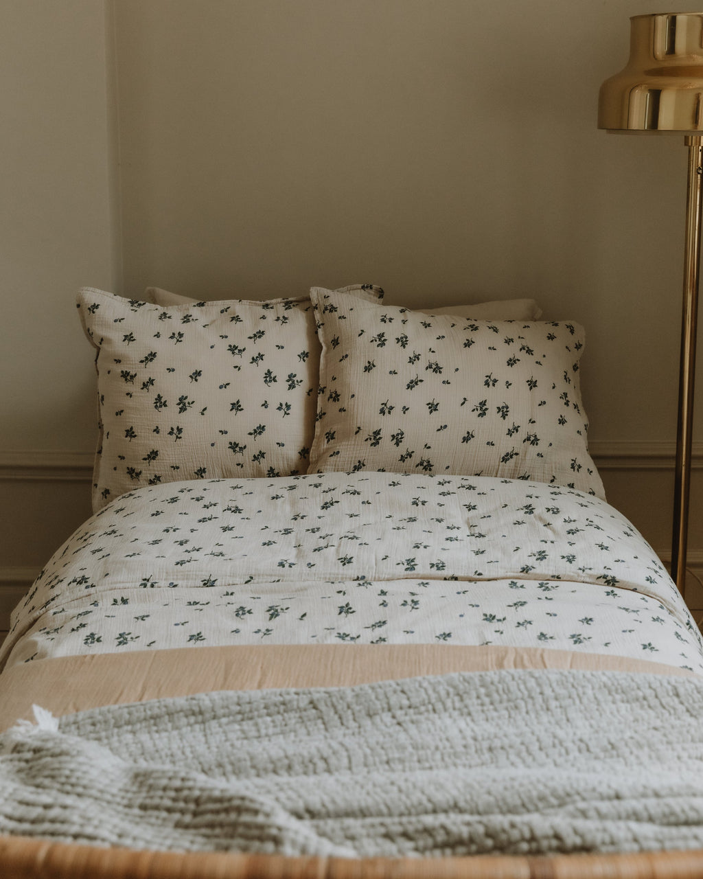 Blueberry muslin pillowcase with scattered blue floral pattern