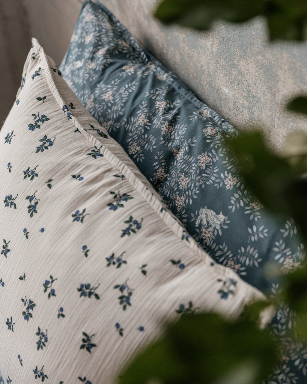 Blueberry muslin pillowcase with scattered blue floral pattern