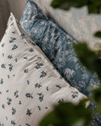 Blueberry muslin pillowcase with scattered blue floral pattern