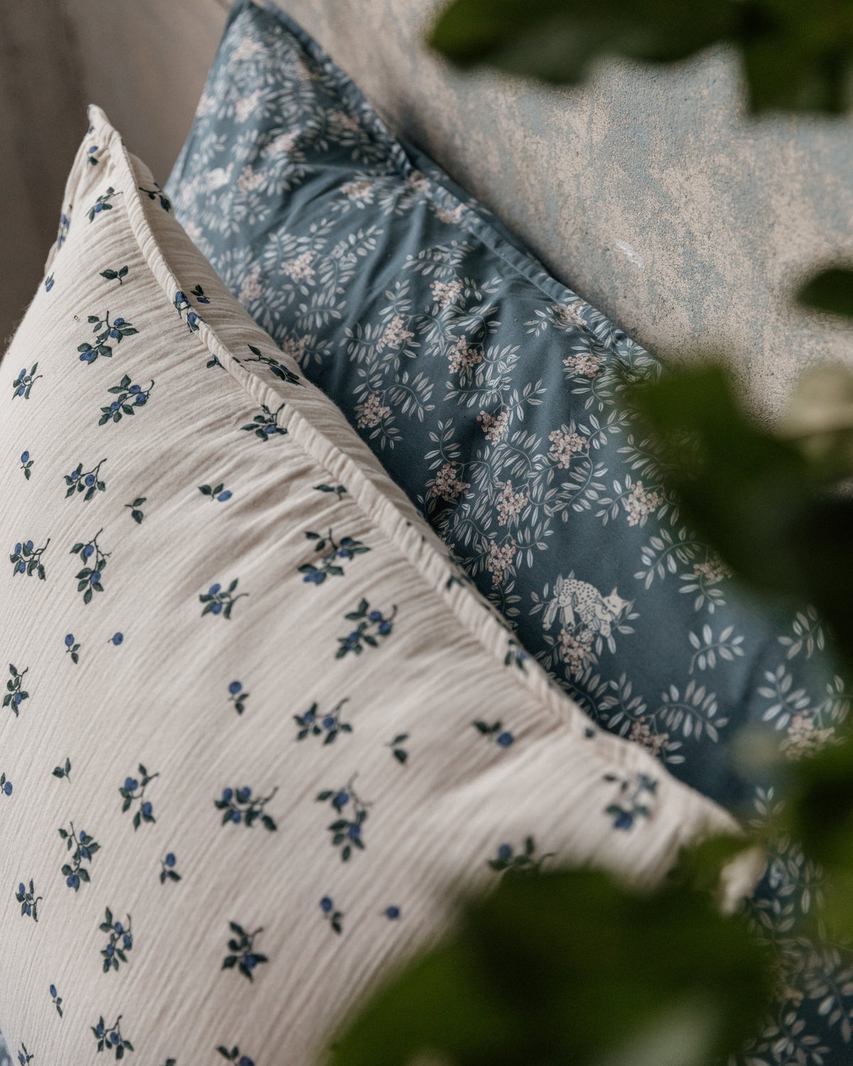 Blueberry muslin pillowcase with scattered blue floral pattern