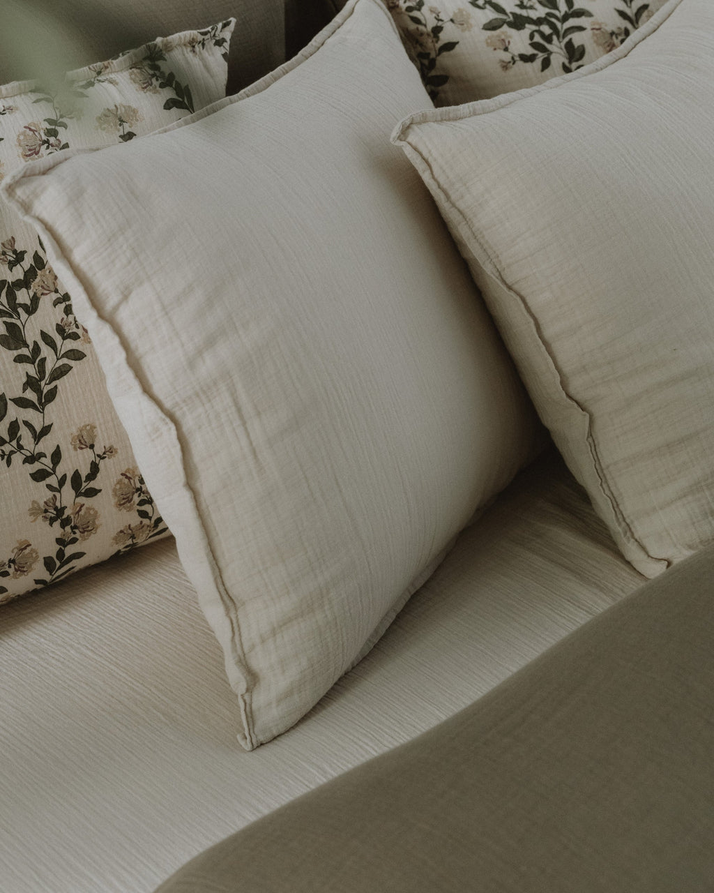 Cream muslin pillowcase with a softly crinkled texture and finished edges