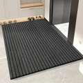 Rectangular ribbed striped doormat with dark edging by an entrance