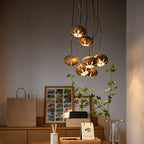 Cluster multi-light chandelier with suspended wood-effect pendant shades