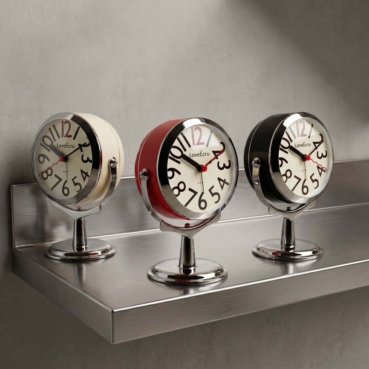 Round analogue alarm clock with bold numerals and raised metallic-effect stand