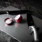 Three grey metal cutting boards with rounded corners and hanging handles