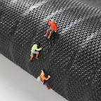 Rectangular ribbed striped doormat with dark edging by an entrance