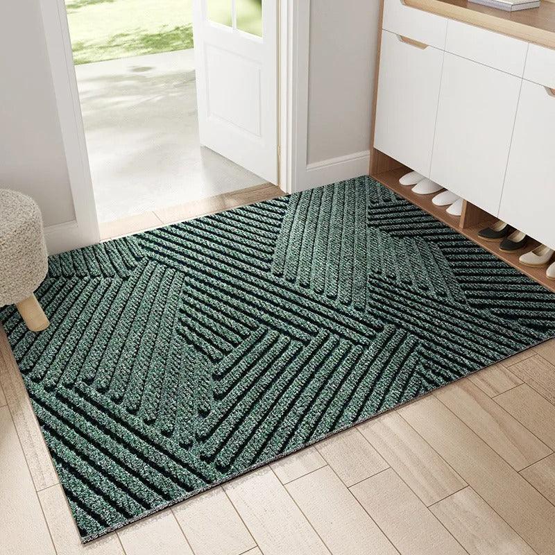 Rectangular ribbed geometric door mat positioned in a home entrance