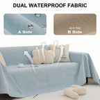Light blue waterproof sofa cover draped over a sofa