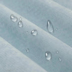 Light blue waterproof sofa cover draped over a sofa