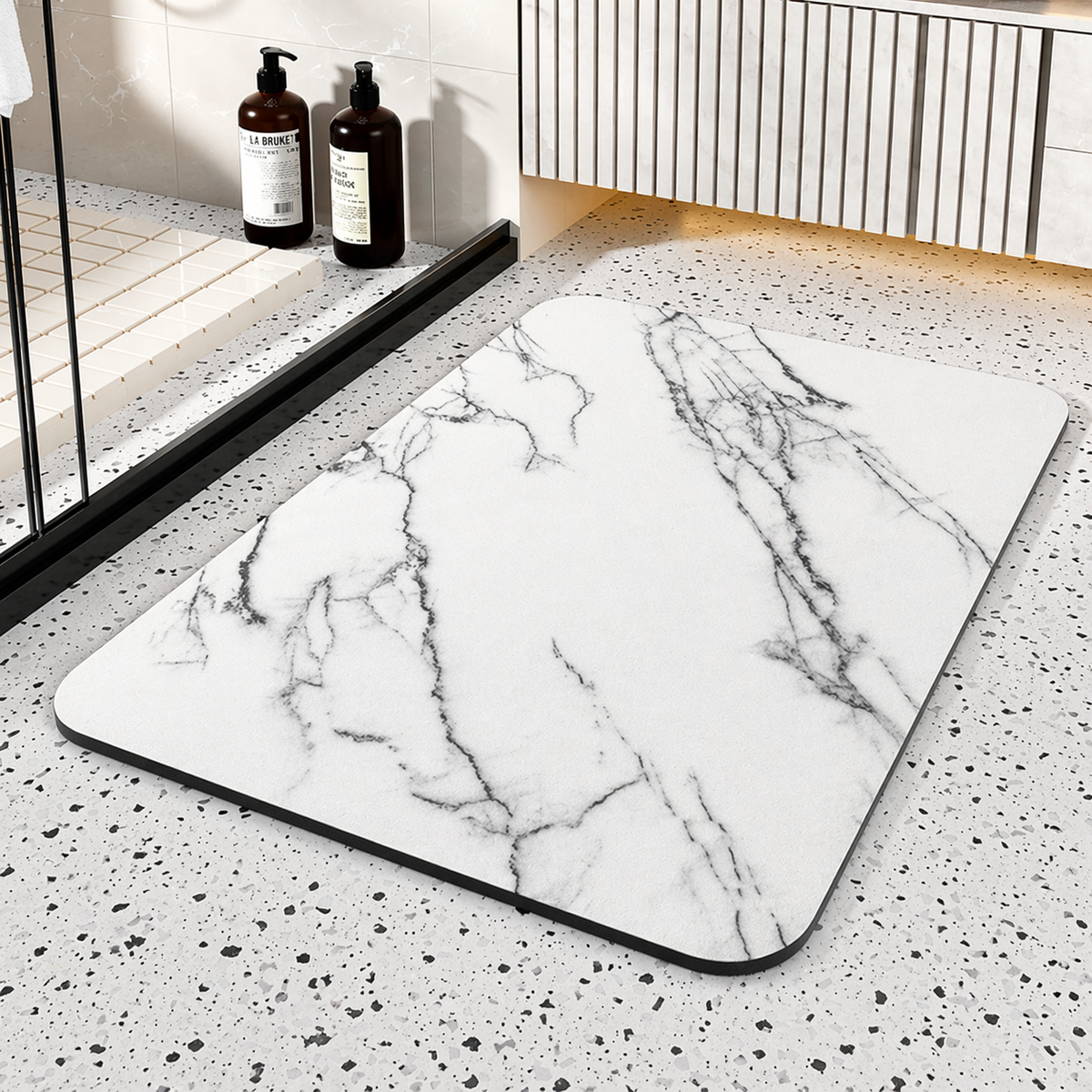 Black rectangular bathroom mat with white marble-effect veining and rounded corners