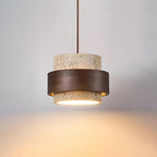 Pendant light with textured travertine shade and brown outer band