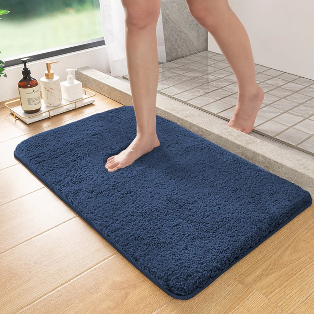 Plush rectangular bathroom floor mat with rounded corners and textured surface