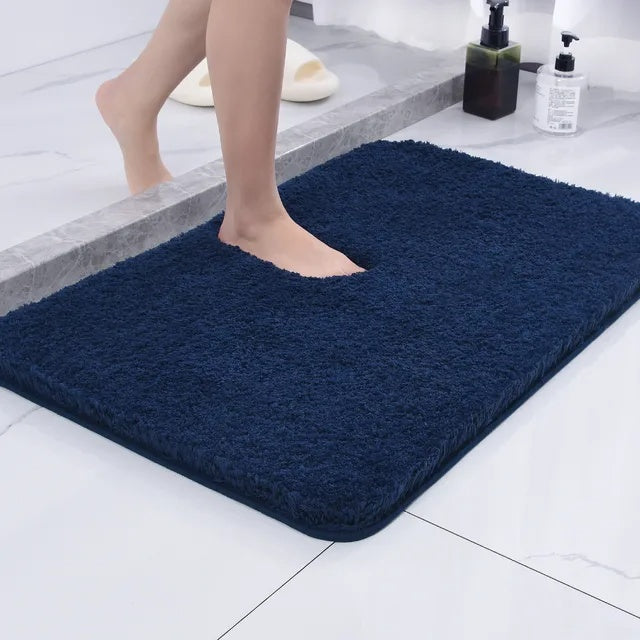 Plush rectangular bathroom floor mat with rounded corners and textured surface