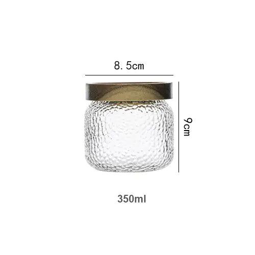 Clear hammered glass storage jar with dark timber lid