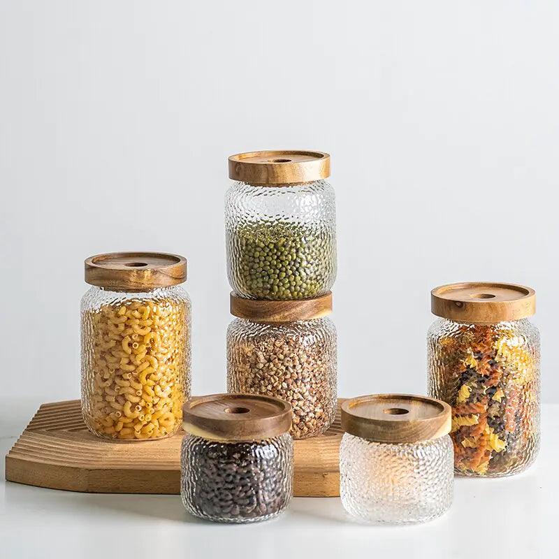 Clear hammered glass storage jar with dark timber lid