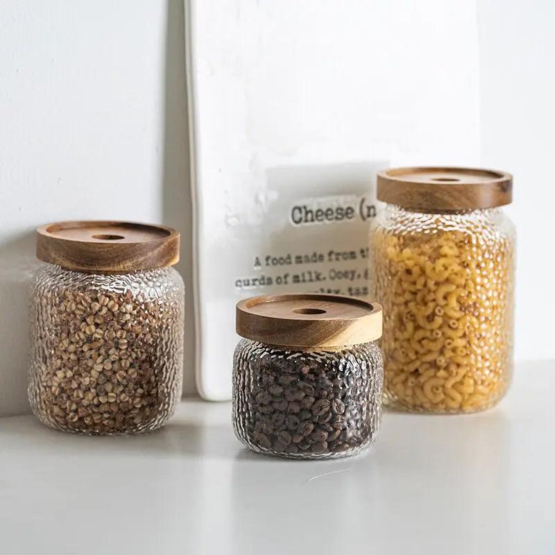 Clear hammered glass storage jar with dark timber lid