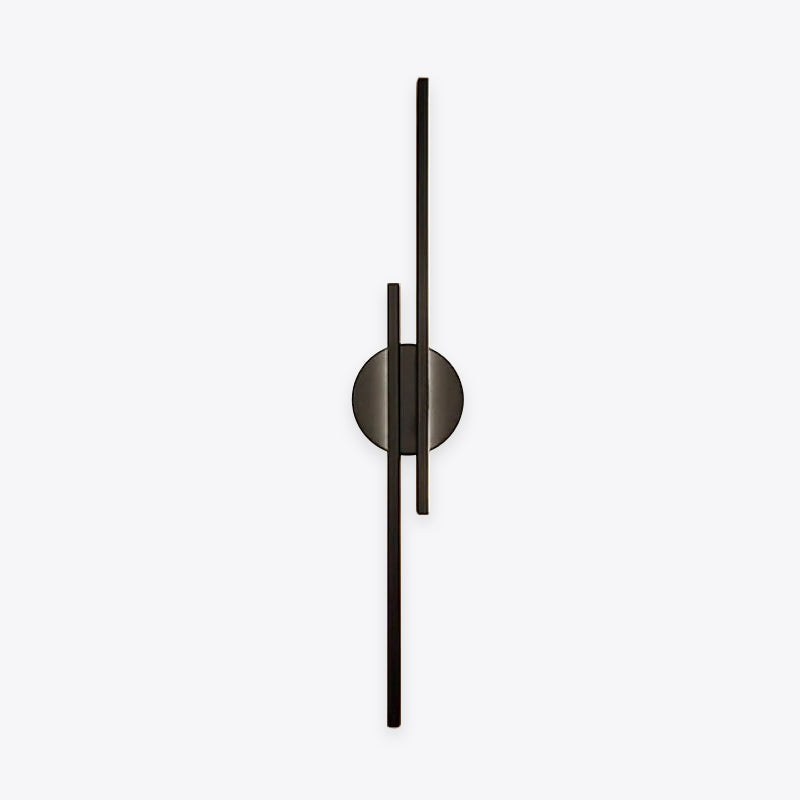 Linear metal wall sconce with round backplate