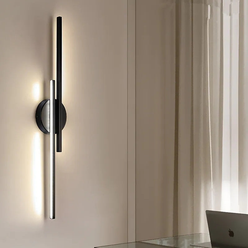 Linear metal wall sconce with round backplate