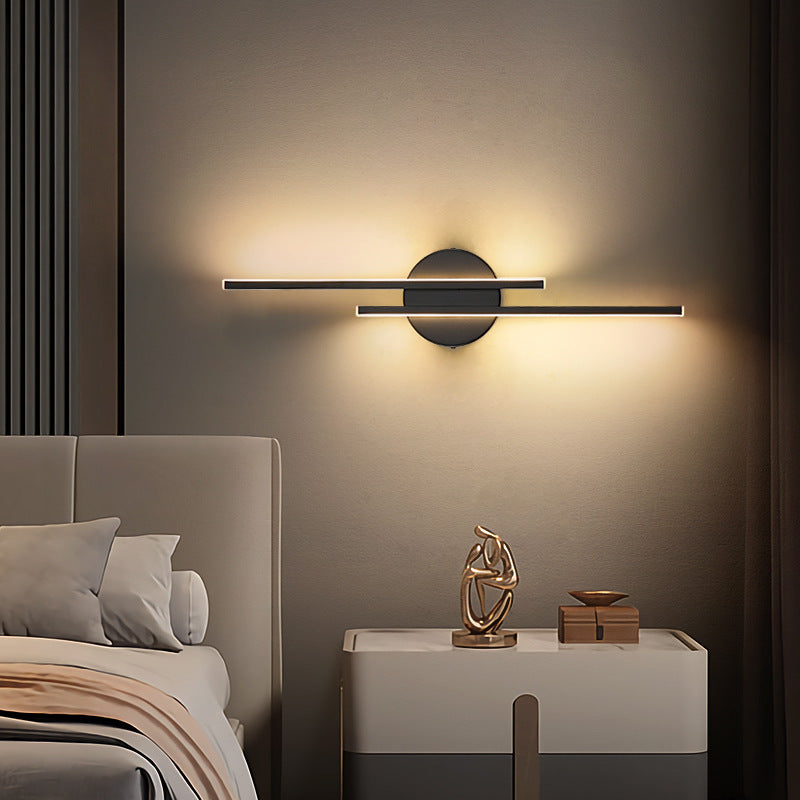 Linear metal wall sconce with round backplate