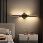Linear metal wall sconce with round backplate