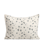 Blueberry muslin pillowcase with scattered blue floral pattern