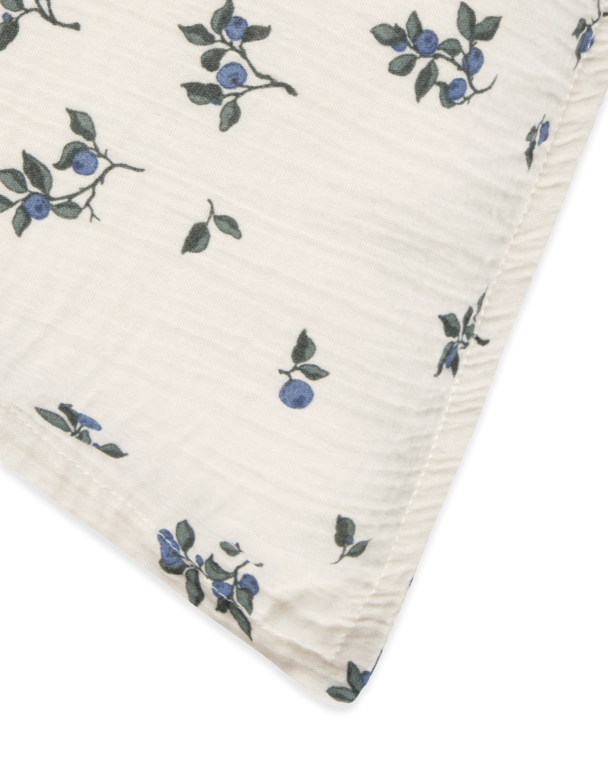 Blueberry muslin pillowcase with scattered blue floral pattern