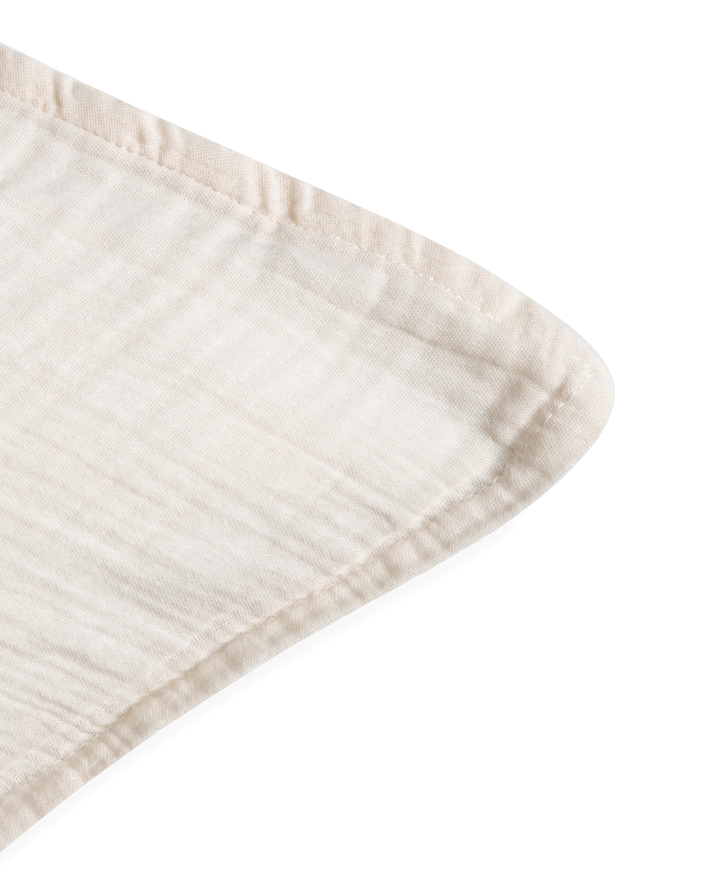 Cream muslin pillowcase with a softly crinkled texture and finished edges