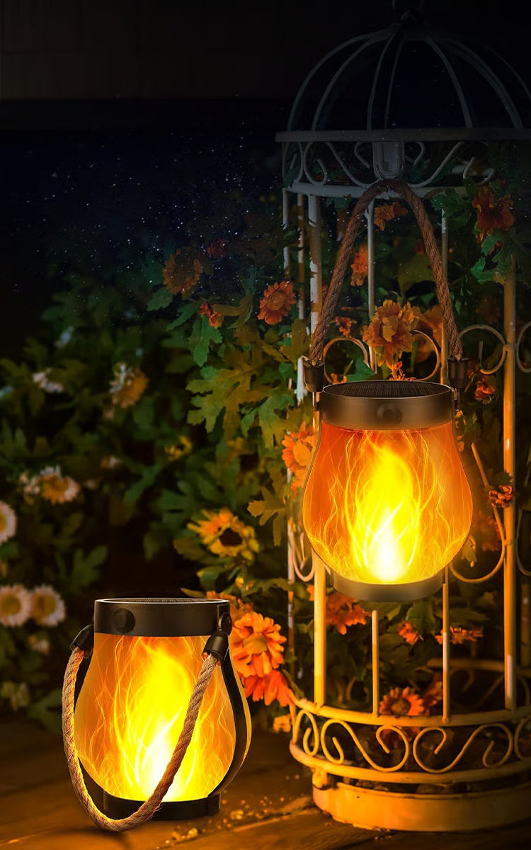 Solar garden lanterns with flame-effect lights and rope handles
