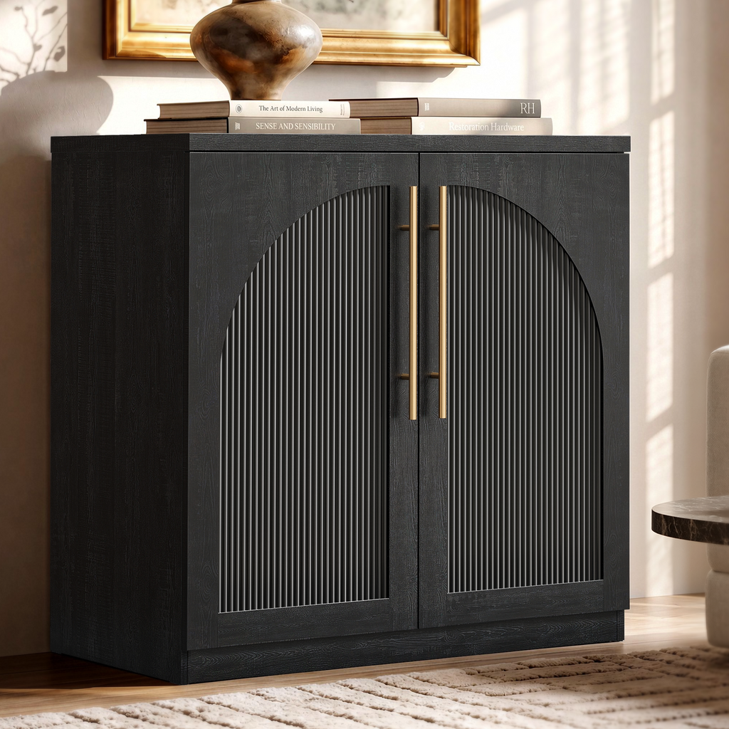 Black arched accent cabinet with fluted double doors and gold-tone handles