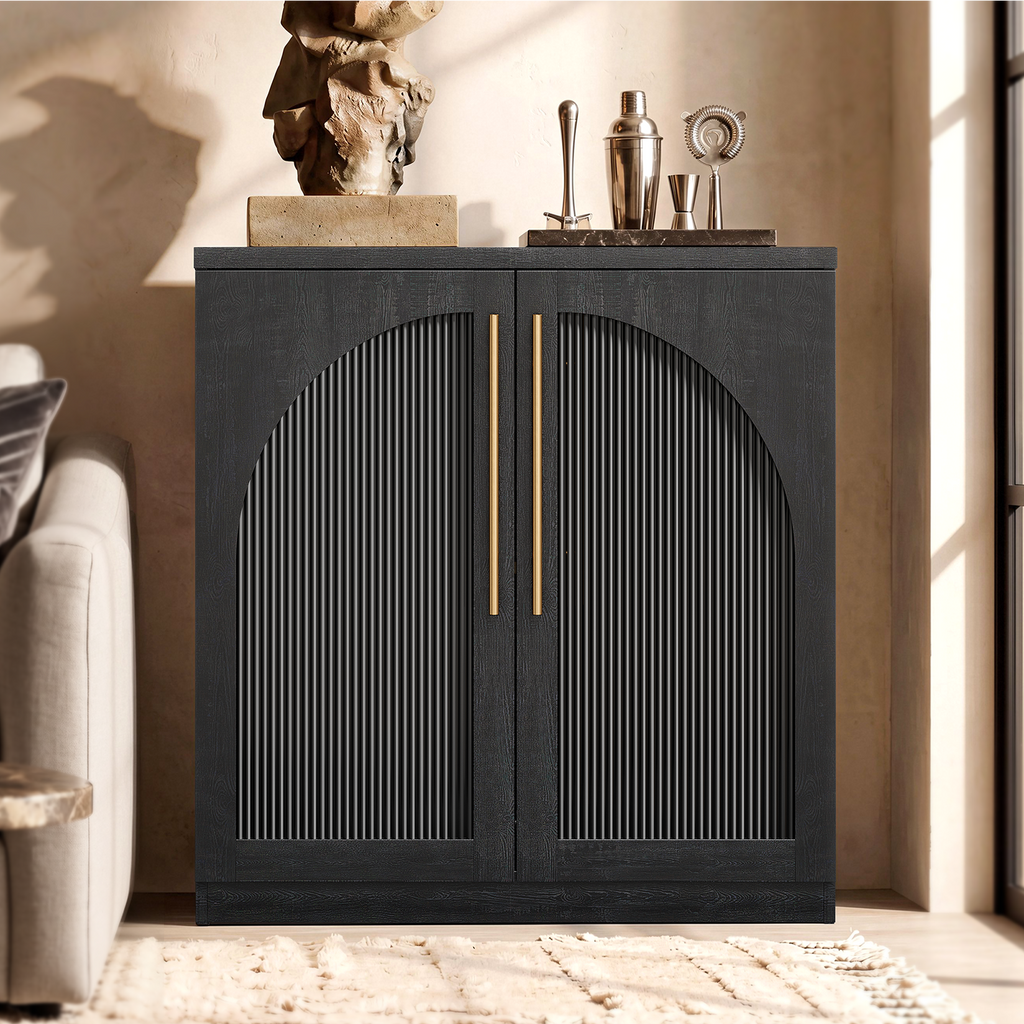 Black arched accent cabinet with fluted double doors and gold-tone handles