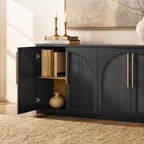 Black arched accent cabinet with fluted double doors and gold-tone handles