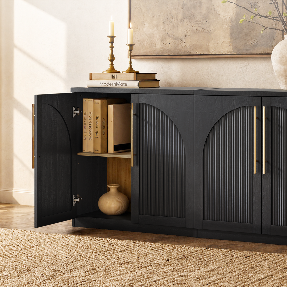 Black arched accent cabinet with fluted double doors and gold-tone handles