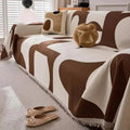 Geometric chenille sofa cover with fringed edge