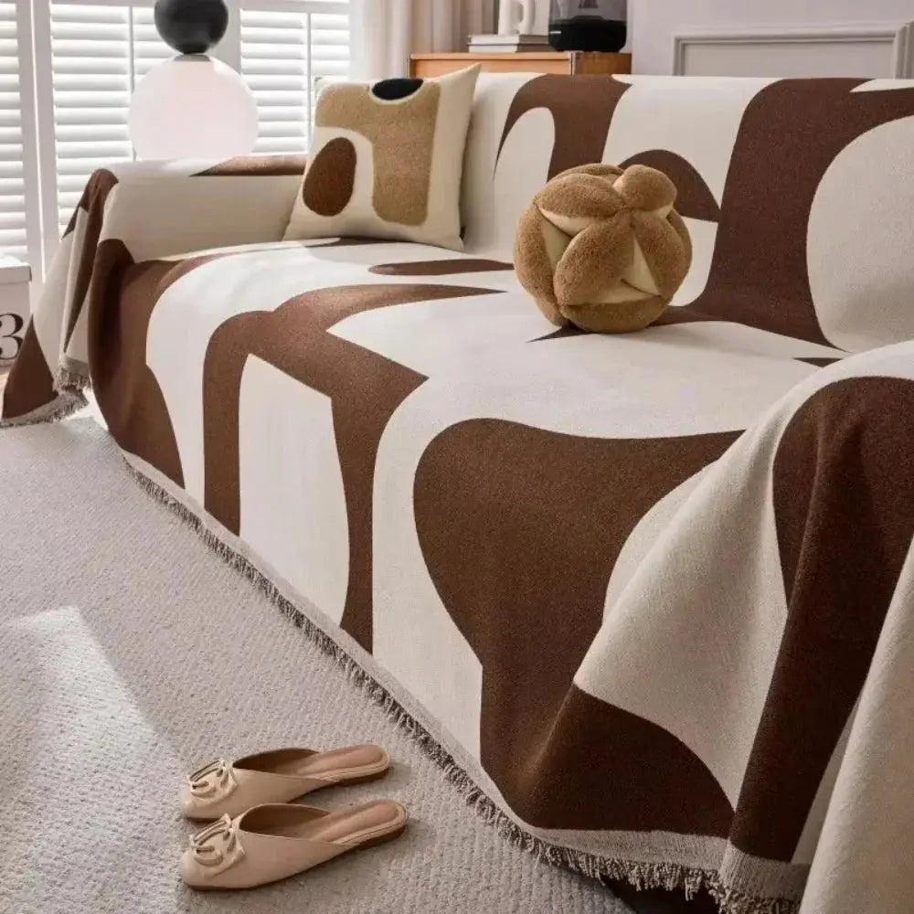 Geometric chenille sofa cover with fringed edge
