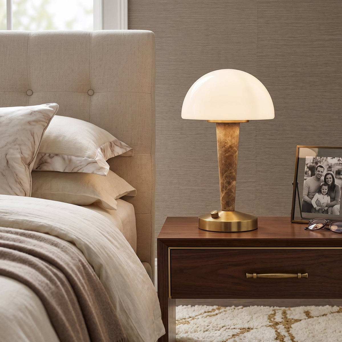 Table lamp with white dome shade, gold base and marble-effect stem