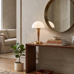 Table lamp with white dome shade, gold base and marble-effect stem