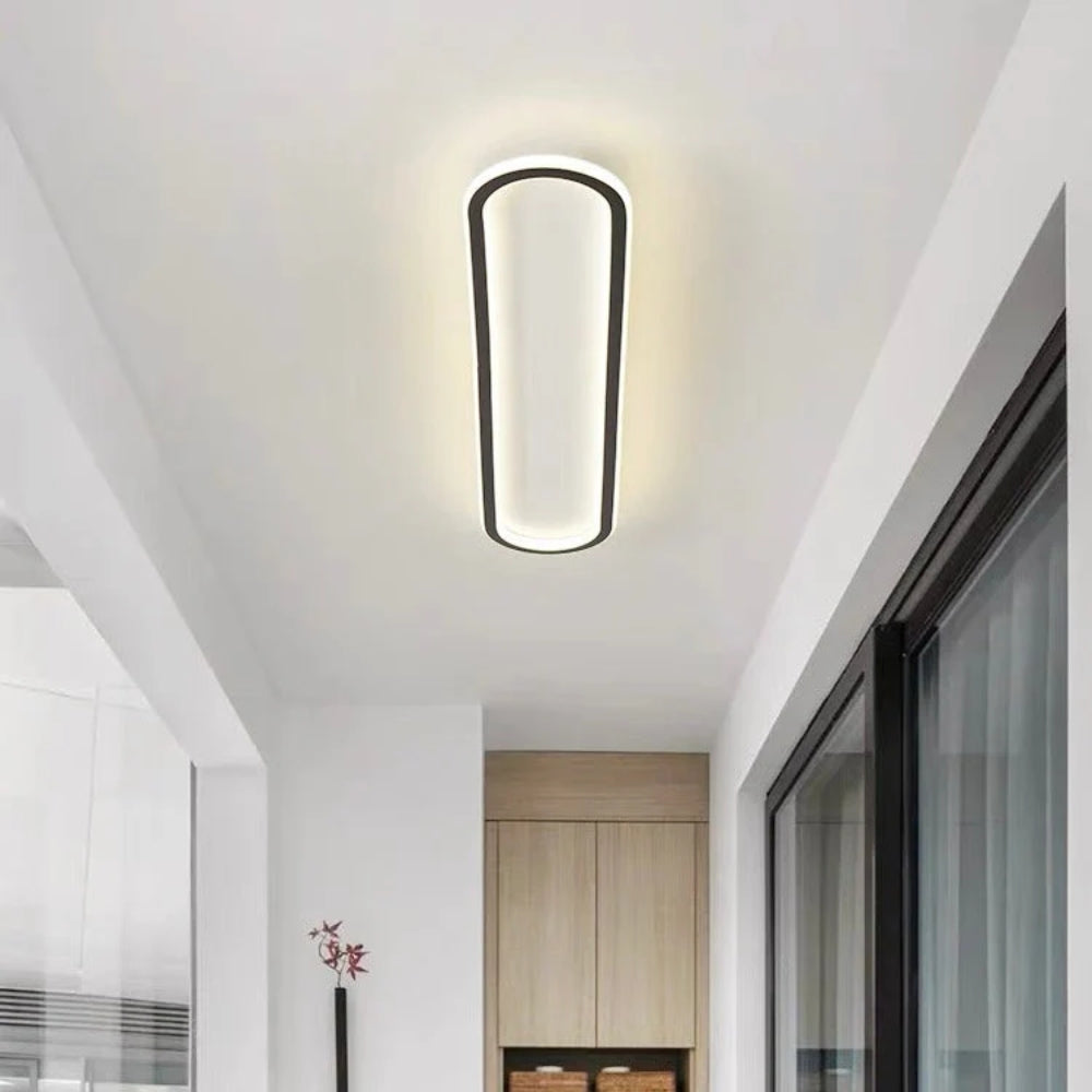 Long oval LED ceiling light with a slim illuminated border