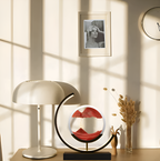 Decorative circular table lamp with sand art display and illuminated frame