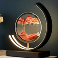 Decorative circular table lamp with sand art display and illuminated frame