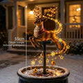 Illuminated Christmas garden stake light with seasonal figure and star and snowflake decorations