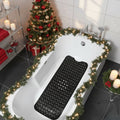 Textured non-slip bath mat with suction cups inside a bath