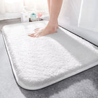 Thick soft-pile rectangular bathroom mat with rounded corners and a non-slip base