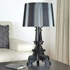 Baroque-inspired table lamp with ribbed shade and ornate scroll base