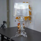Baroque-inspired table lamp with ribbed shade and ornate scroll base