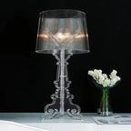 Baroque-inspired table lamp with ribbed shade and ornate scroll base